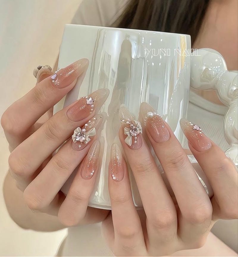 nail thạch màu hồng đính nơ xinh xắn